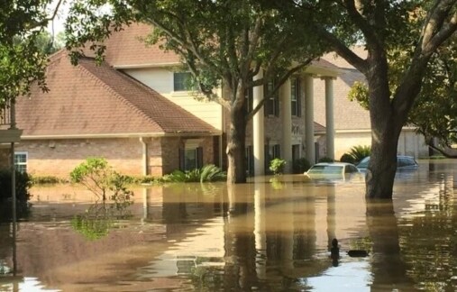 Home with rising flood waters