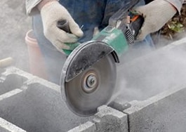 cutting into cement blocks with saw