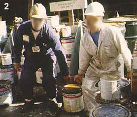 Two people lifting heavier cans