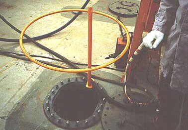 circular hatch ring guard is bolted over an open deck