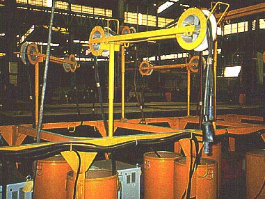 Welding unit with electric cable over pulleys