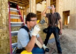 Construction workers drinking water