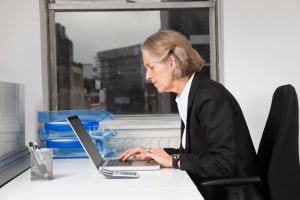 woman working on a laptop computer