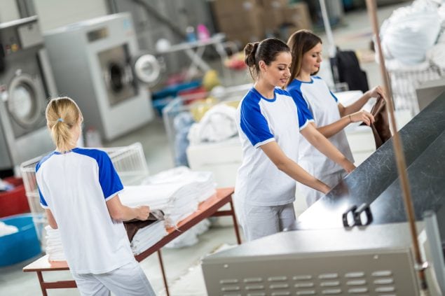 Employees in laundry facility
