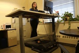 woman using a treadmill desk
