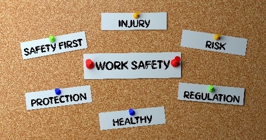 cork board with work safety related titles