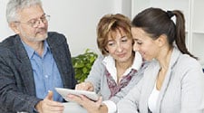 Man and 2 women reviewing document