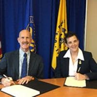 NIOSH Director John Howard, MD and BCSP Board President Linda Martin, CSP sign MOU to extend partnership aimed at reducing injuries and ensuring the health of young workers.