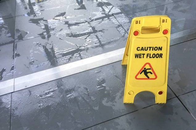 caution wet floor sign on wet floor