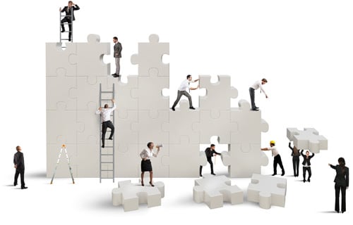 image of office workers constructing puzzle