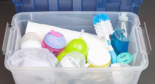 Cleaning supplies in a bin