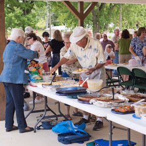 People gathered for a pot-luck dinner