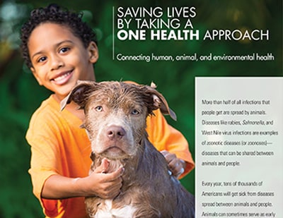 Image of young boy standing with a dog. Text reads: Saving Lives by Taking a One Health Approach