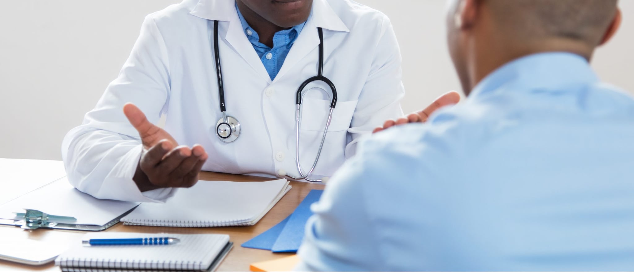 African American Doctor Explaining Diagnosis To Patient