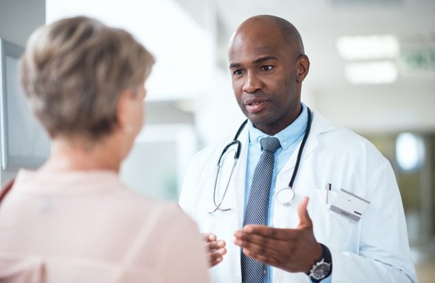 photo of a doctor speaking to a patient