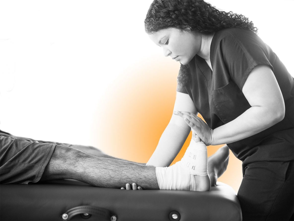 a physical therapist working with a patient