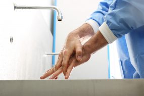 Clinician washing their hands.