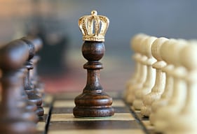 The image shows “chess success” with a crown on the Queen chess piece’s head. Free photo.