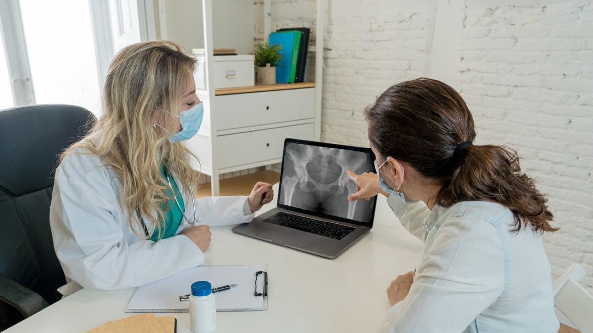 a doctor showing a scan to patient