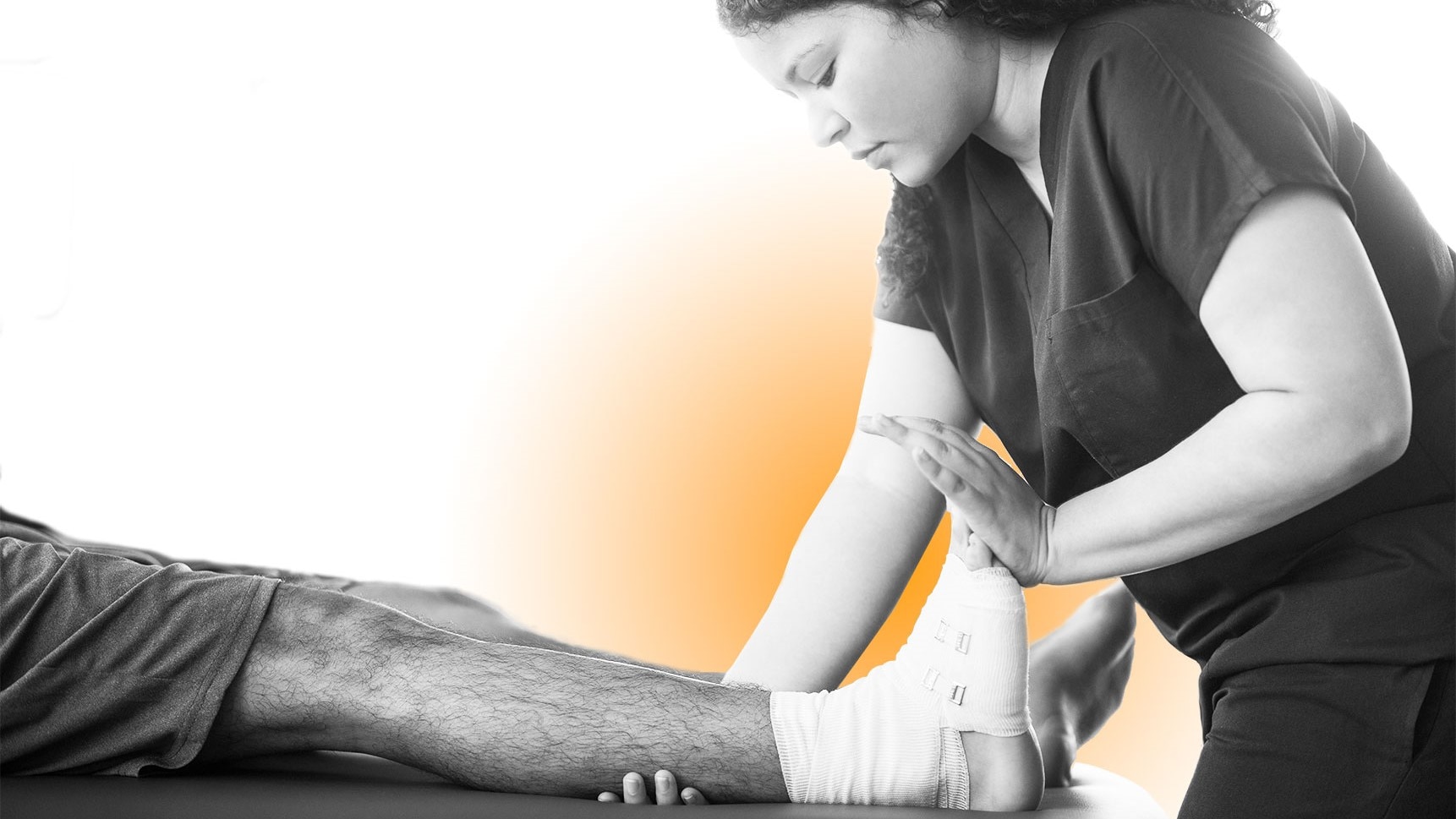 A physical therapist working with a patient experiencing pain.