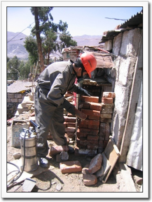 Image of a man spraying insecticide in Southern Peru