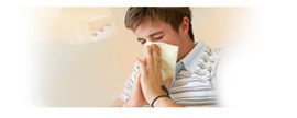 Graphic showing a teen-aged boy blowing his nose.