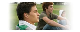 Graphic of two teen-aged boys sitting on the sidewalk.