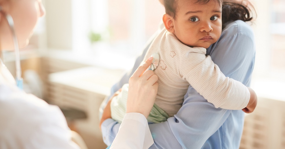 Doctor examining the child