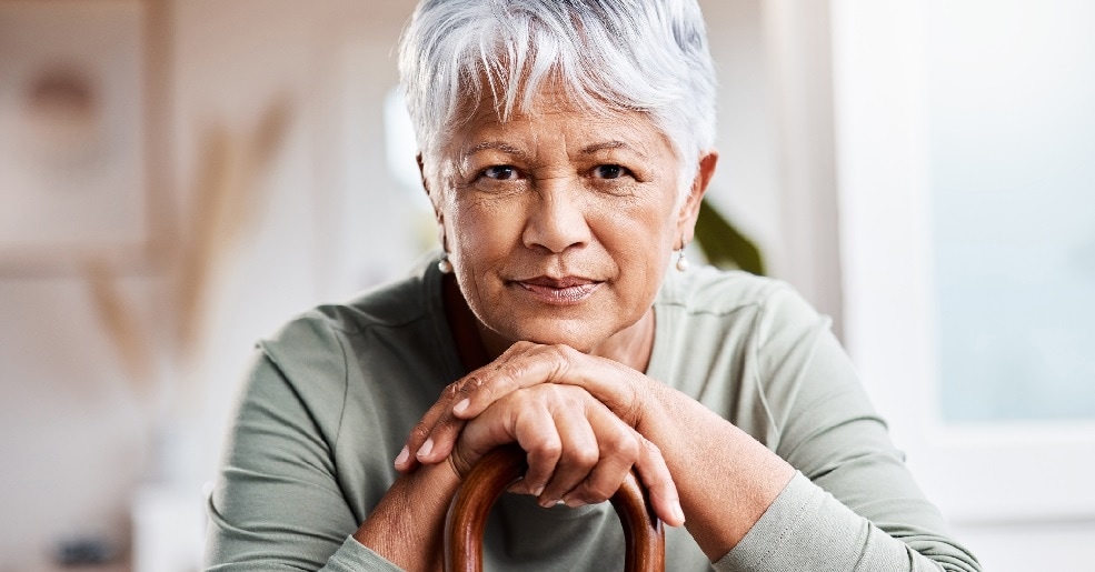 Older middle aged woman with grey hair.