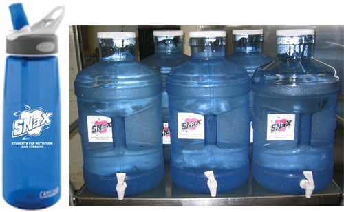The first picture shows one of the reusable water bottles that was distributed to all students and staff. The second picture shows 5-gallon dispensers that are filled with filtered, chilled tap water.