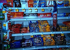 Photo of convenience store aisle filled with candy