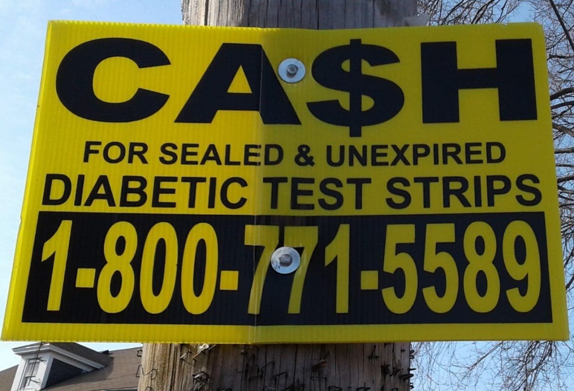Sign advertising offers to buy diabetes test strips. Photo produced by author.