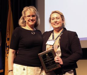 2018 Salinas Award Winner, Brittany Anderson (right), was presented with the 2018 Louis Salinas award, by her CDC supervisor, Heidi Davidson.
