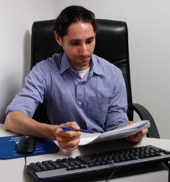 Victor Cabada reviewing data in an office
