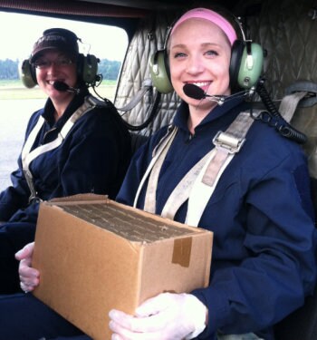 Katherine Mullican is a helicopter passenger with a carton of rabies vaccines