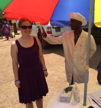 Emma Prasher at a temperature checkpoint in Guinea
