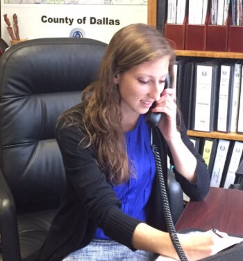 Julia Ritch talking on the phone in an office