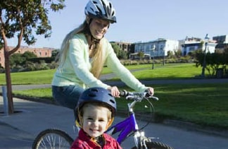 Photo: Mother and son riding a bicycle.