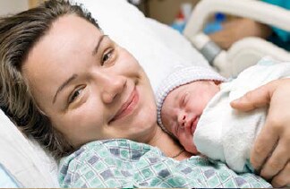 Photo: Mother holding a newborn.