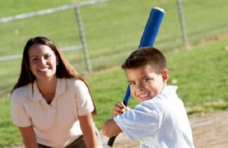 Photo: Woman and boy playing baseball
