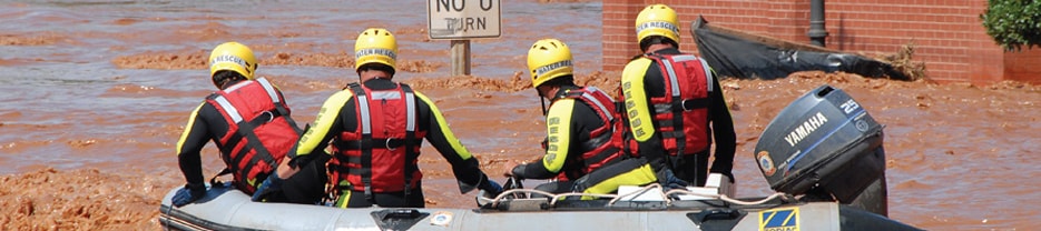 Men in a boat responding to a crisis