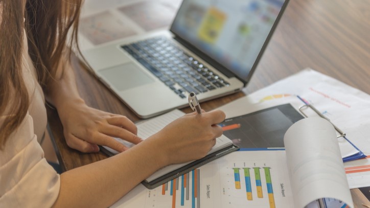 Closeup Of Businesswoman Hand Writing Notes In Her Office