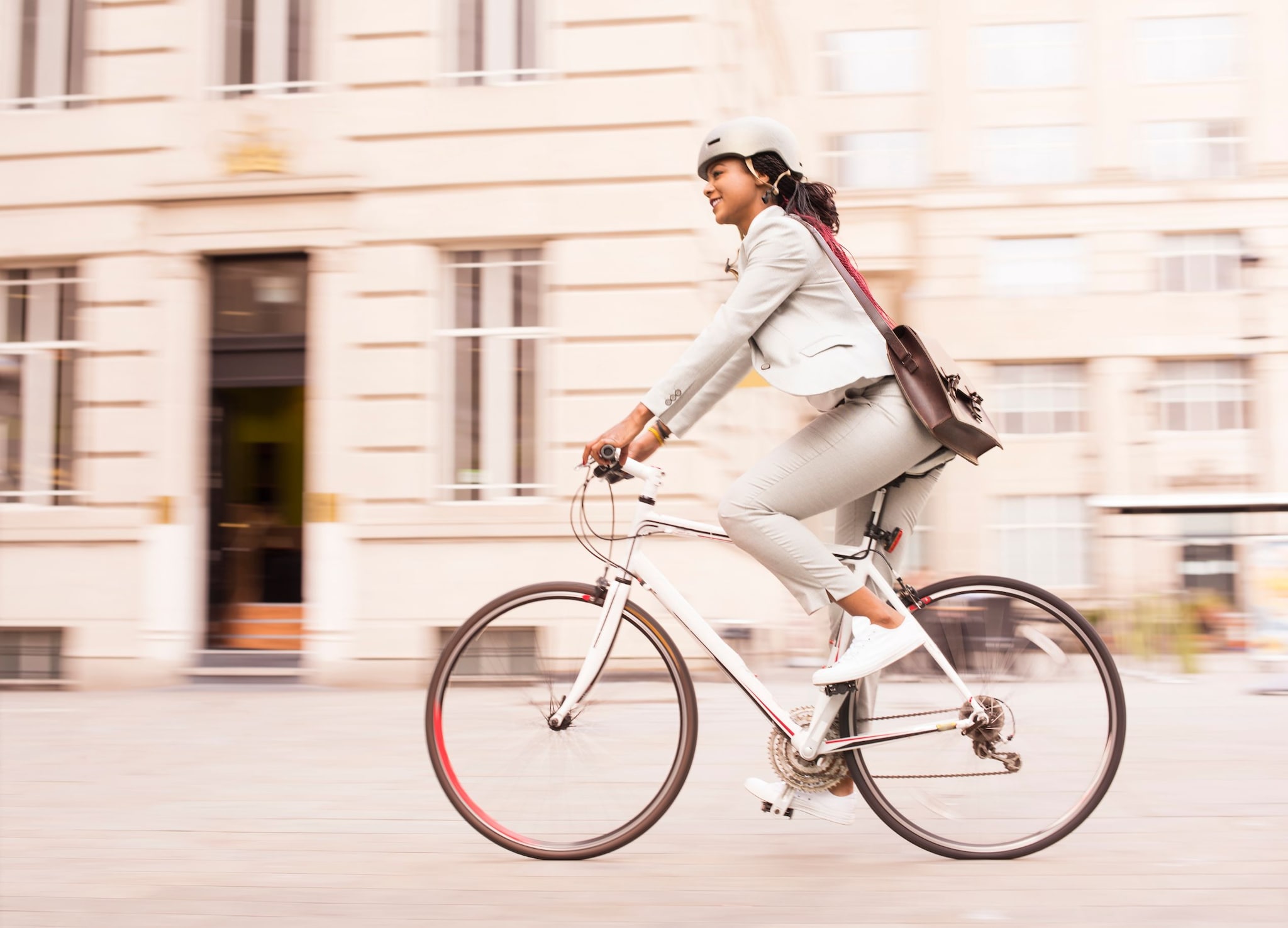 Business woman commuting on bike