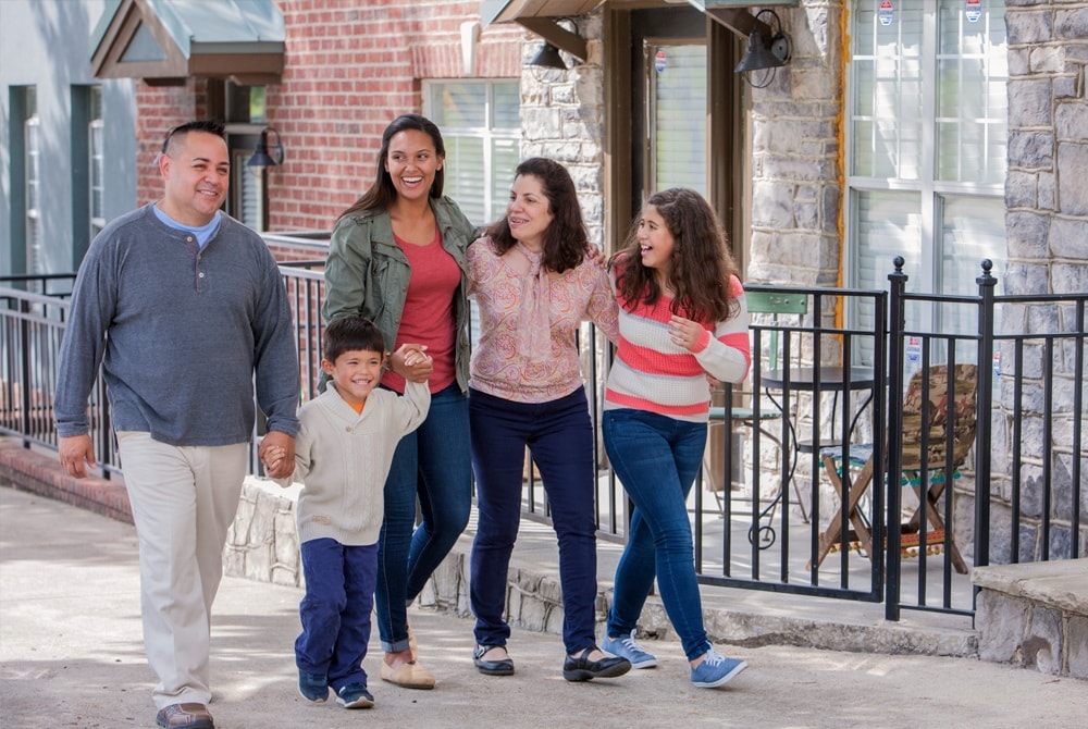 Latino family walking on the sidewalk
