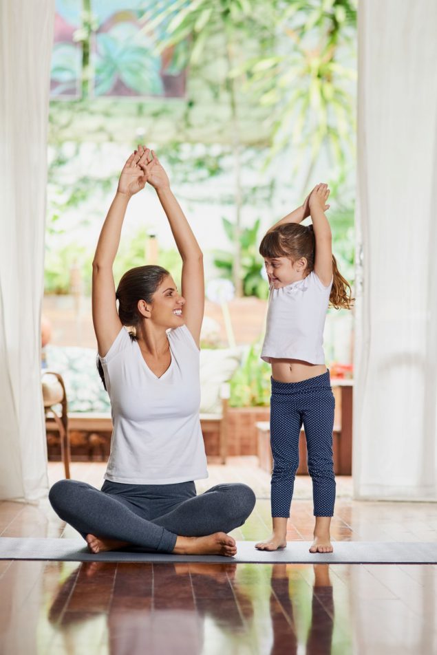 mother and daughter stretching
