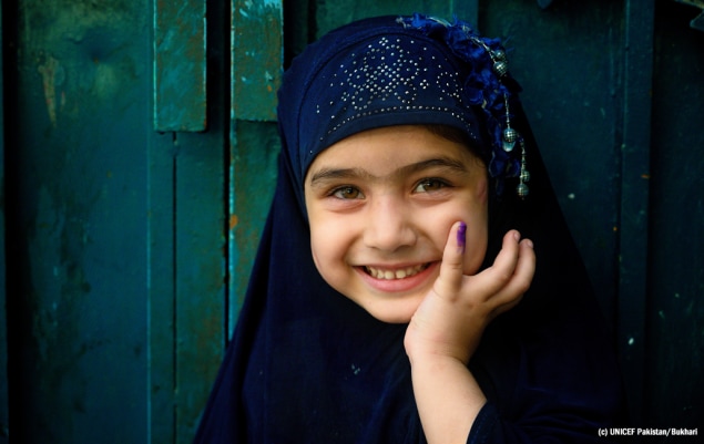 Vaccinated girl with purple finger