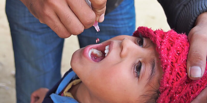 Nepalese boy receiving oral polio vaccination