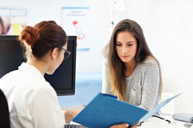Woman consulting with her doctor