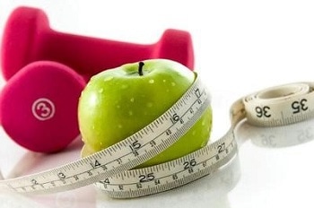 Apple, weights, and measuring tape