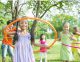 children playing hula hoop